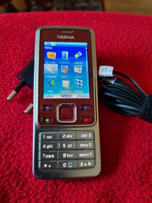 Bijna gratis goed werkende Nokia 6300,met oplader,14