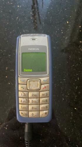 Blauwe Nokia 1110 met lader