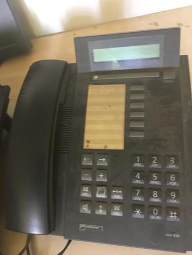 Doos vol ISDN apparatuur KPN VOX Tiptel etc.