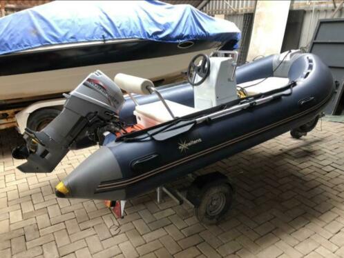 Excellent Rib met 25 pk Mariner 3 cilinder en kalf trailer.