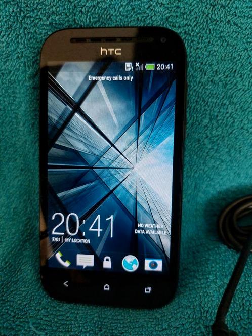 HTC one SV met oortjes en lader