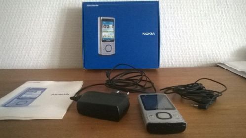 Mooie goedwerkende Nokia 6700 Slide met toebehoren
