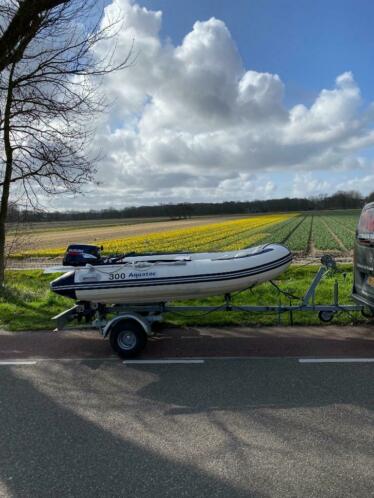 Mooie rubberboot met harde polyester bodem ,9,9pk 4T suzuki