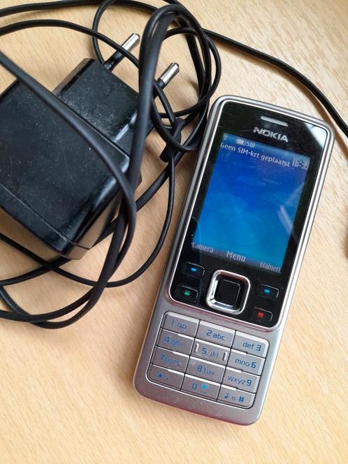 Nokia 6300 telefoon met oplader