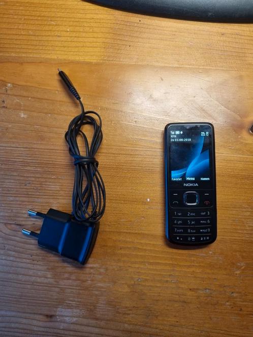 Nokia 6700 met lader , kleur zwart