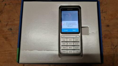 Nokia C3-01 met lader en handleiding in doos