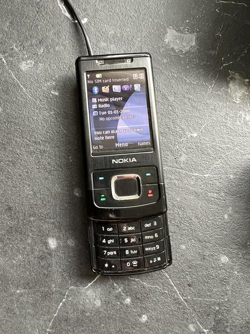 Nokia telefoon.  Zie foto met 2 opladers