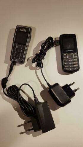 Old Nokia and Samsung mobile phone with chargers