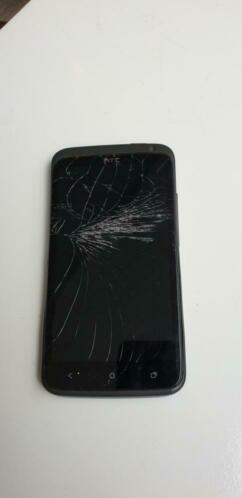 Oude HTC telefoon met gebroken scherm.