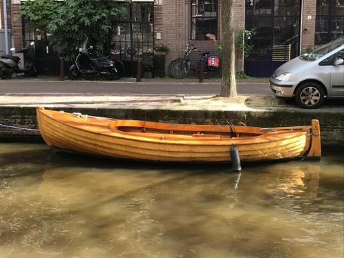 overnaadse houten sloep