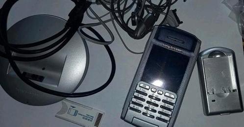 Sony Ericsson met oplader en oortjes