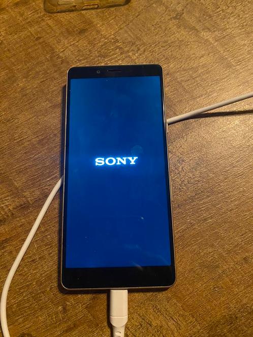 Sony Xperia telefoon WERKEND oplader en hoesje