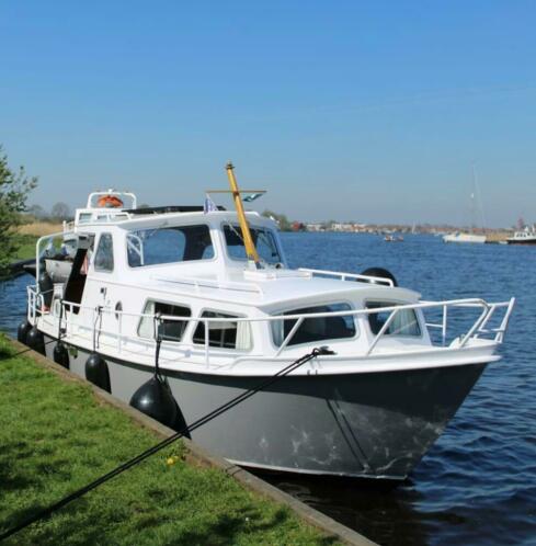 Stalen Otterkruiser - kajuitboot compleet met bijboot en ac