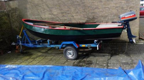 Stalen roeiboot trailer en motor(ligt in Dronten)