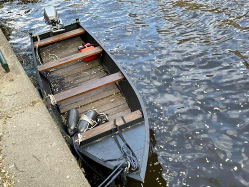 Stalen sloep  grachtenboot met motor