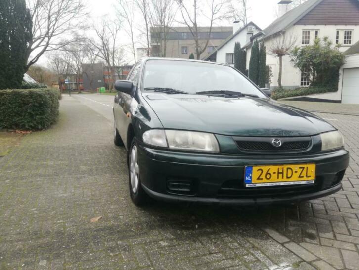 Super onderhoude Mazda 323 1.5 P LX 2001 Kerst Groen-Rood