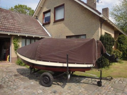 Te koop, roei-visboot met buitenboord motor