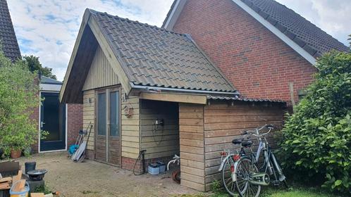 Tuinhuis met extra afdak