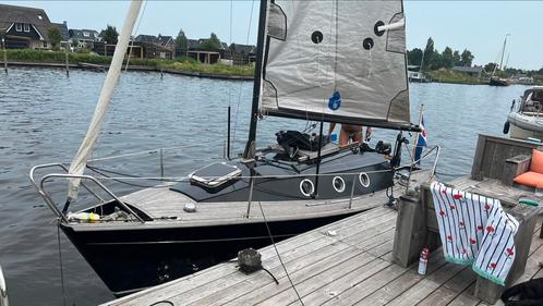Zeilboot hout Stringer 630 met buitenboordmotor en teak dek