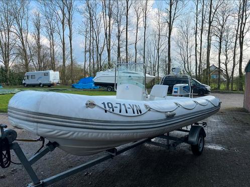 Zodiac rubberboot met 60 pk Suzuki en trailer